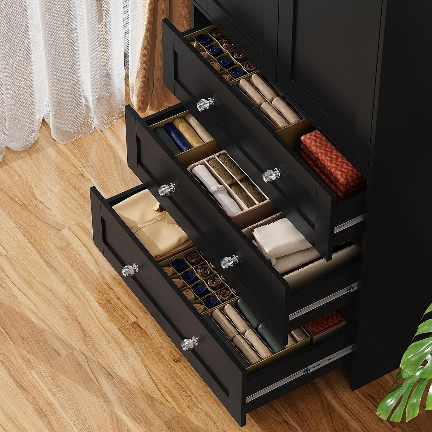 Close-up angled top-down view of three pulled-out drawers showing organized accessories inside