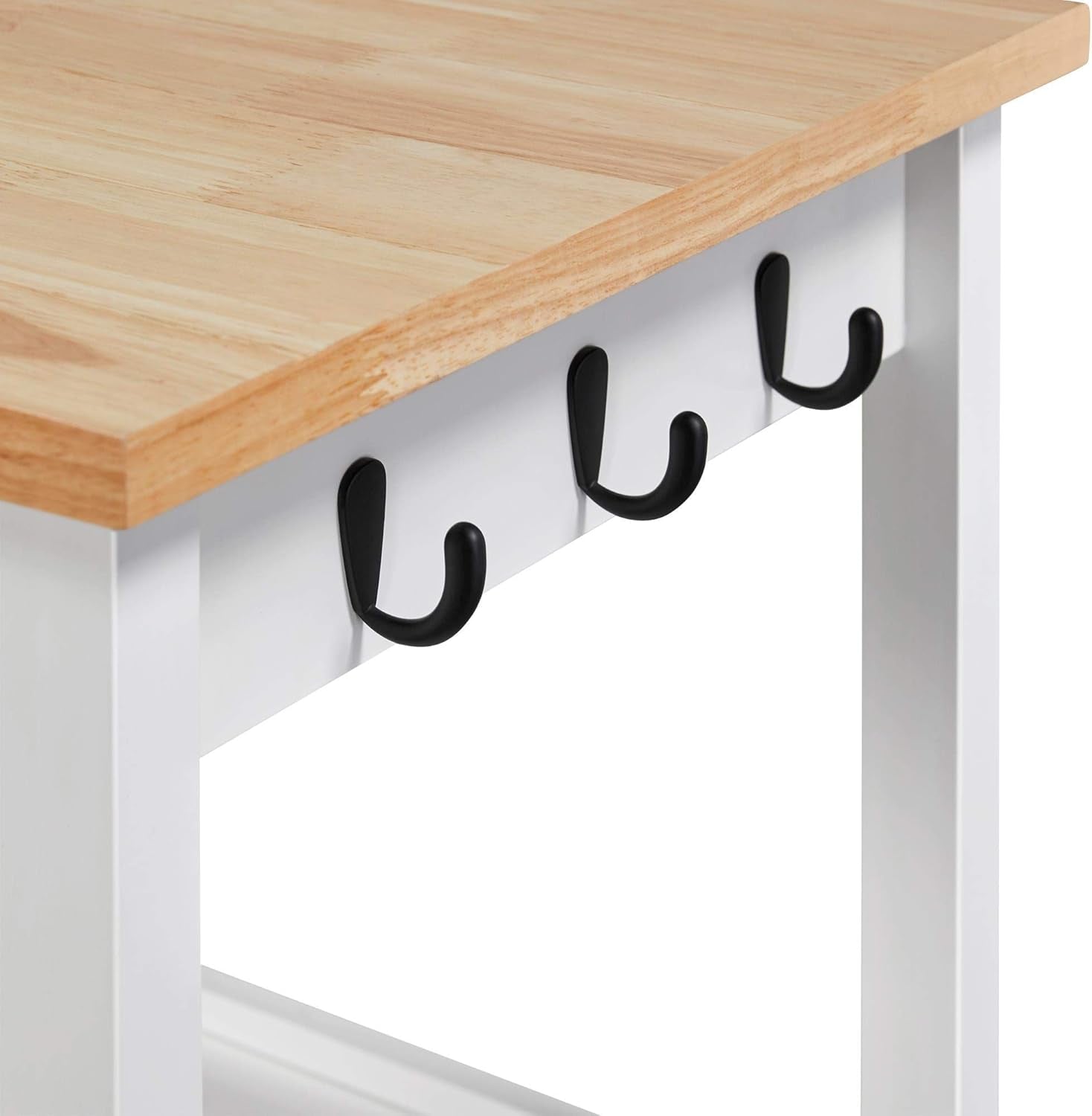Close-up of four black utility hooks mounted beneath the island's wood tabletop.