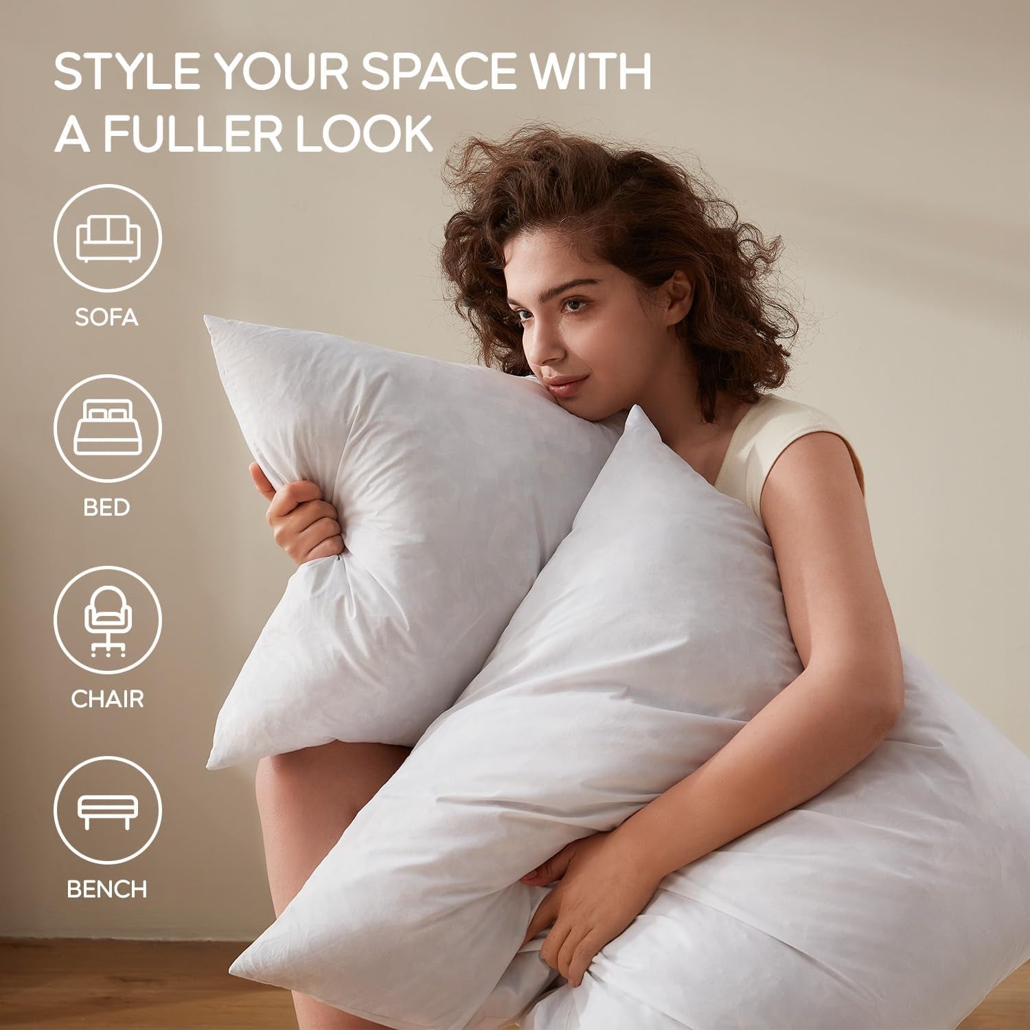 Woman seated holding two large white pillow inserts with icons for sofa, bed, chair and bench