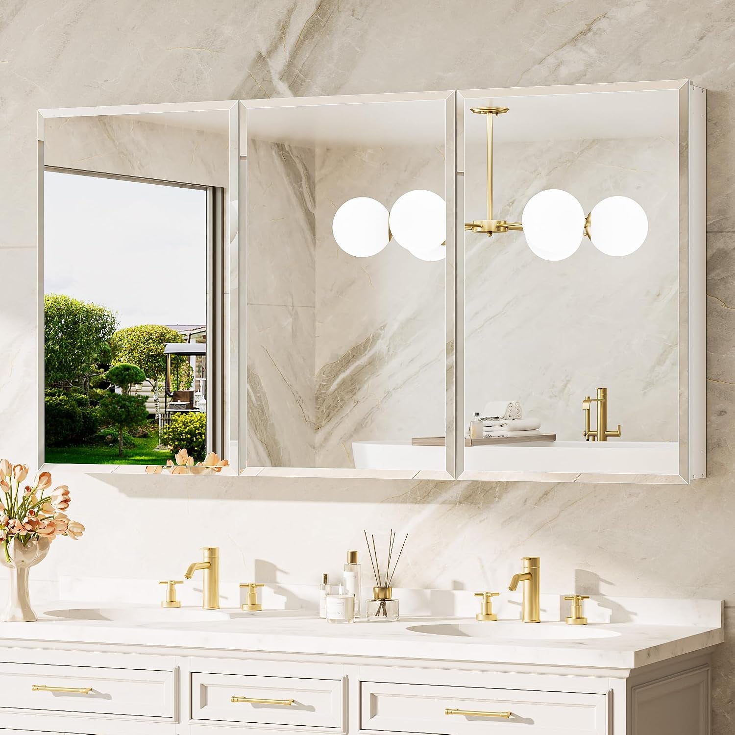 Three mirrored medicine cabinets mounted above a wide vanity with twin sinks and gold hardware