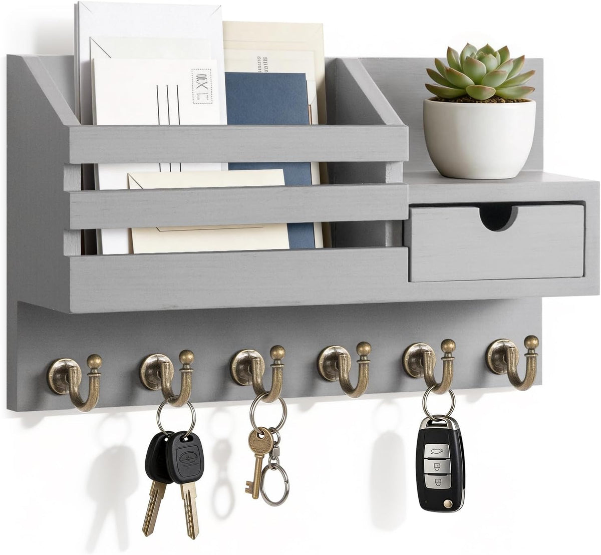 Light gray organizer shown at a slight angle with envelopes in the slot, small drawer and keys on lower hooks.