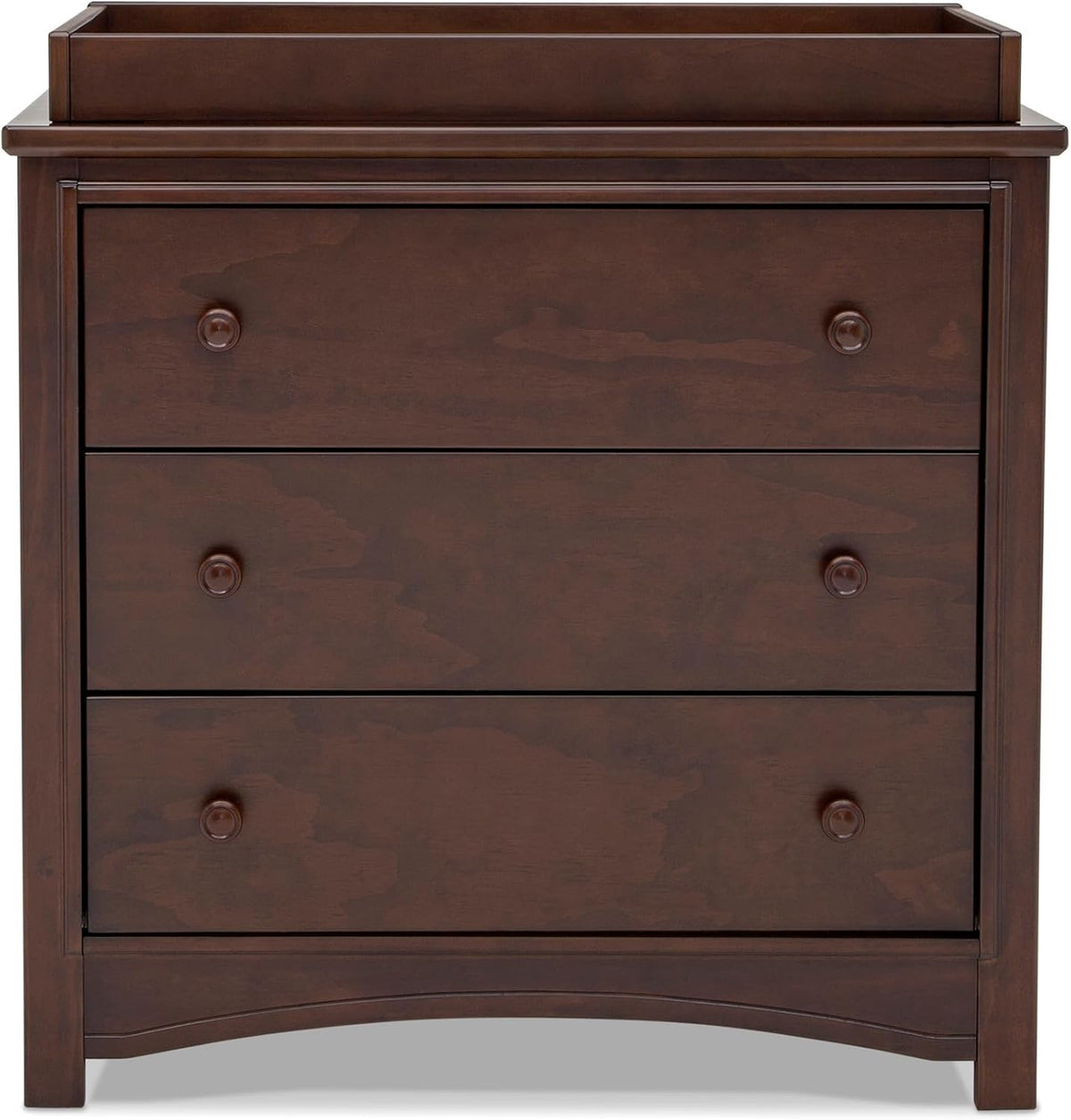 Top-front view focusing on the dresser's raised changing top surround and three flush drawer fronts with knobs.