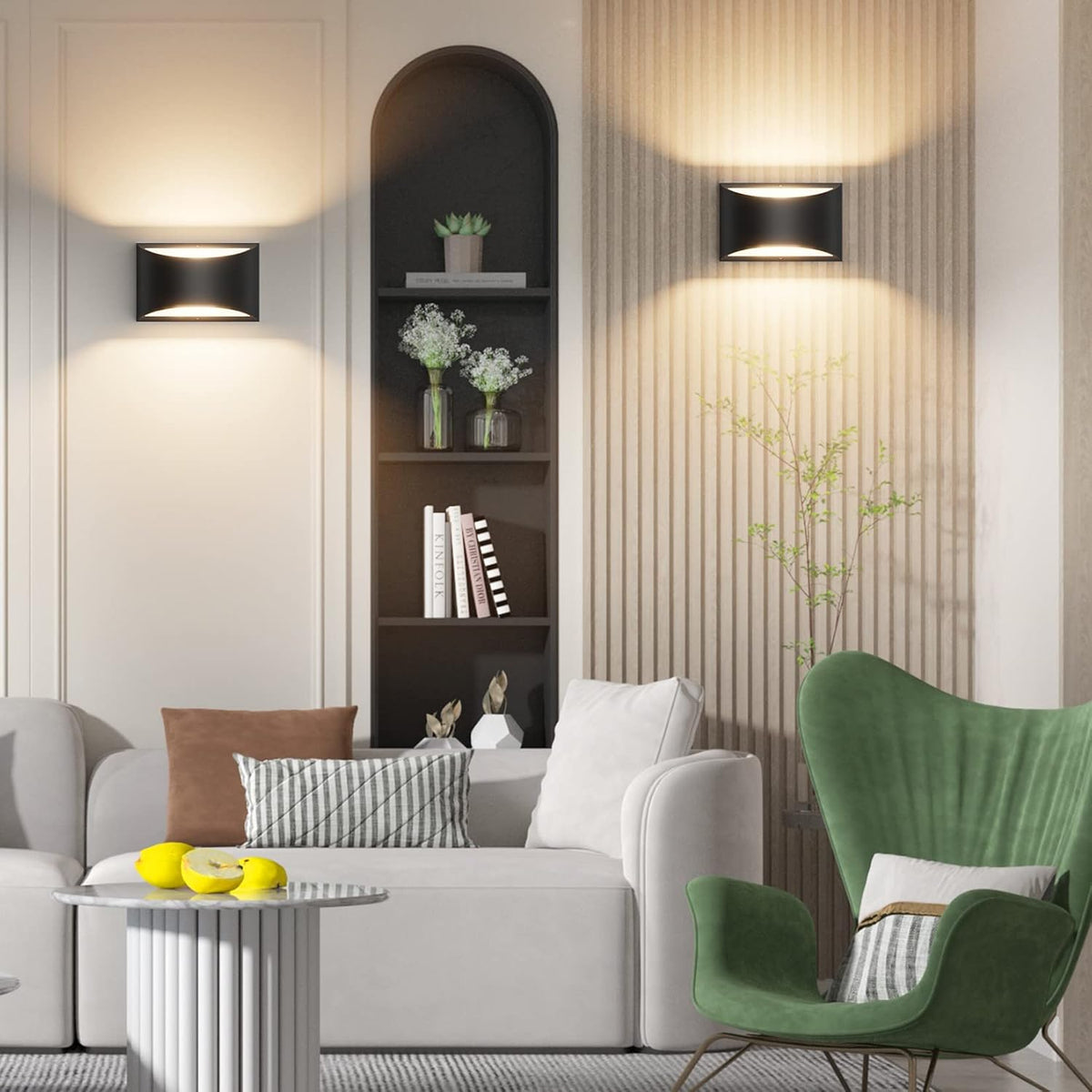 Living room scene with one black up/down sconce mounted above a sofa casting warm light