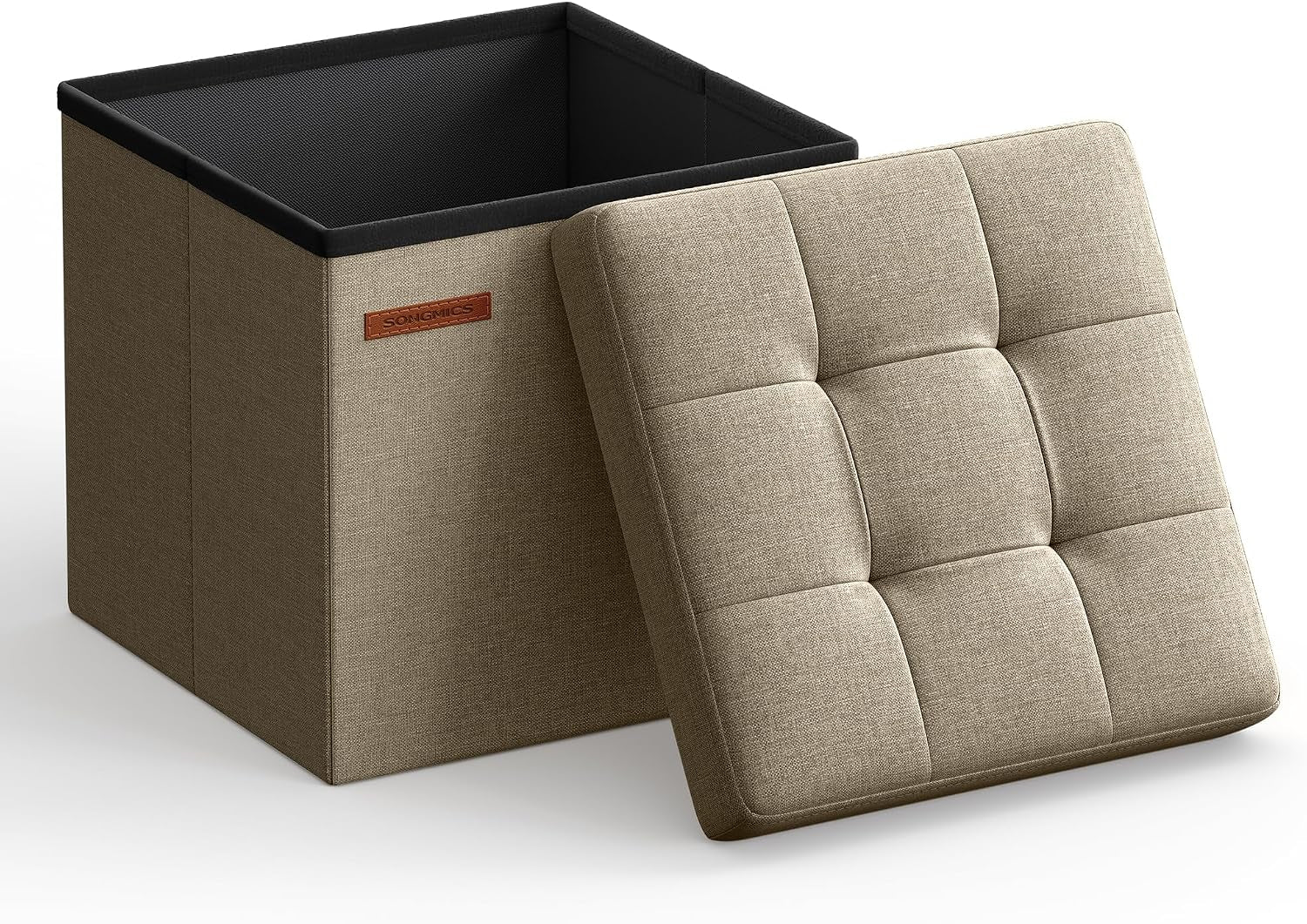 Tan fabric foldable storage cube with its tufted lid leaning against the open box on a white background.