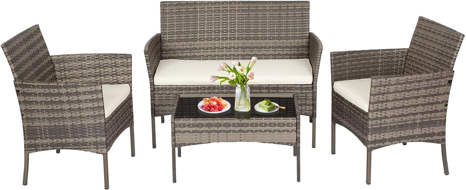 Light gray woven loveseat and two armchairs with cream cushions and a rectangular glass-top coffee table.