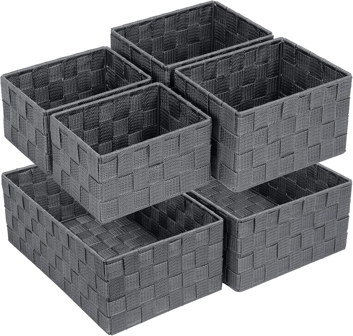 Close angled view of six gray woven baskets arranged in stacked, offset layers.