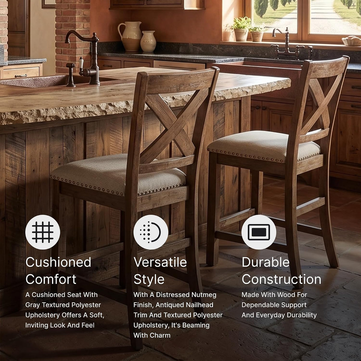 Two beige-upholstered counter stools with X-back and nailhead trim at a rustic kitchen island.