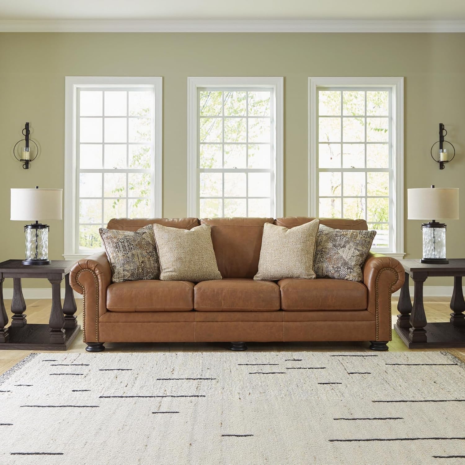 Signature Design by Ashley Carianna Leather Sofa for Living Room, Caramel | Top-Grain Leather Touchpoints, Sag-Resistant Platform Foundation, Classic Rolled Arms with Nailhead Trim