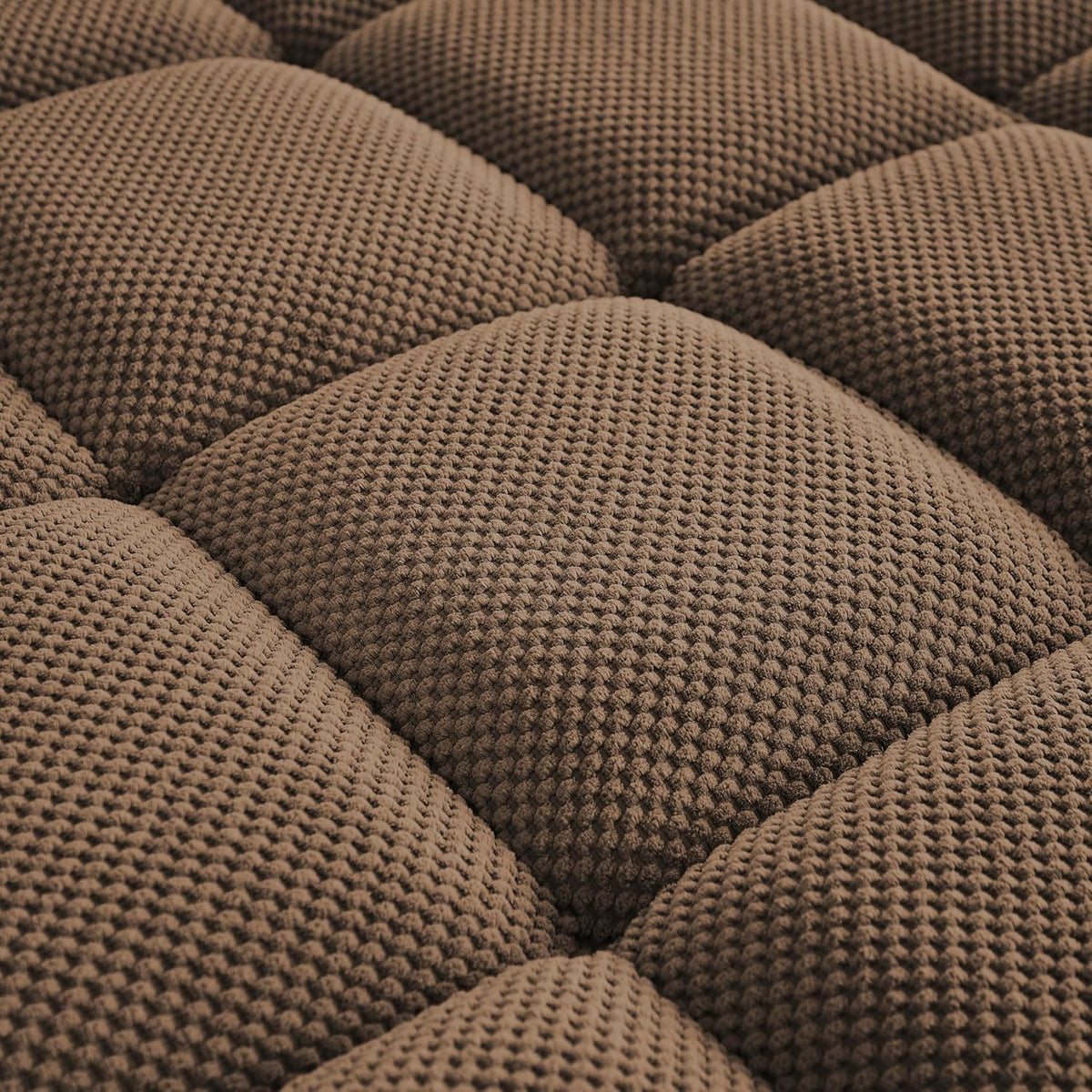 Close-up of brown tufted chenille fabric showing waffle-like texture and square tufting.