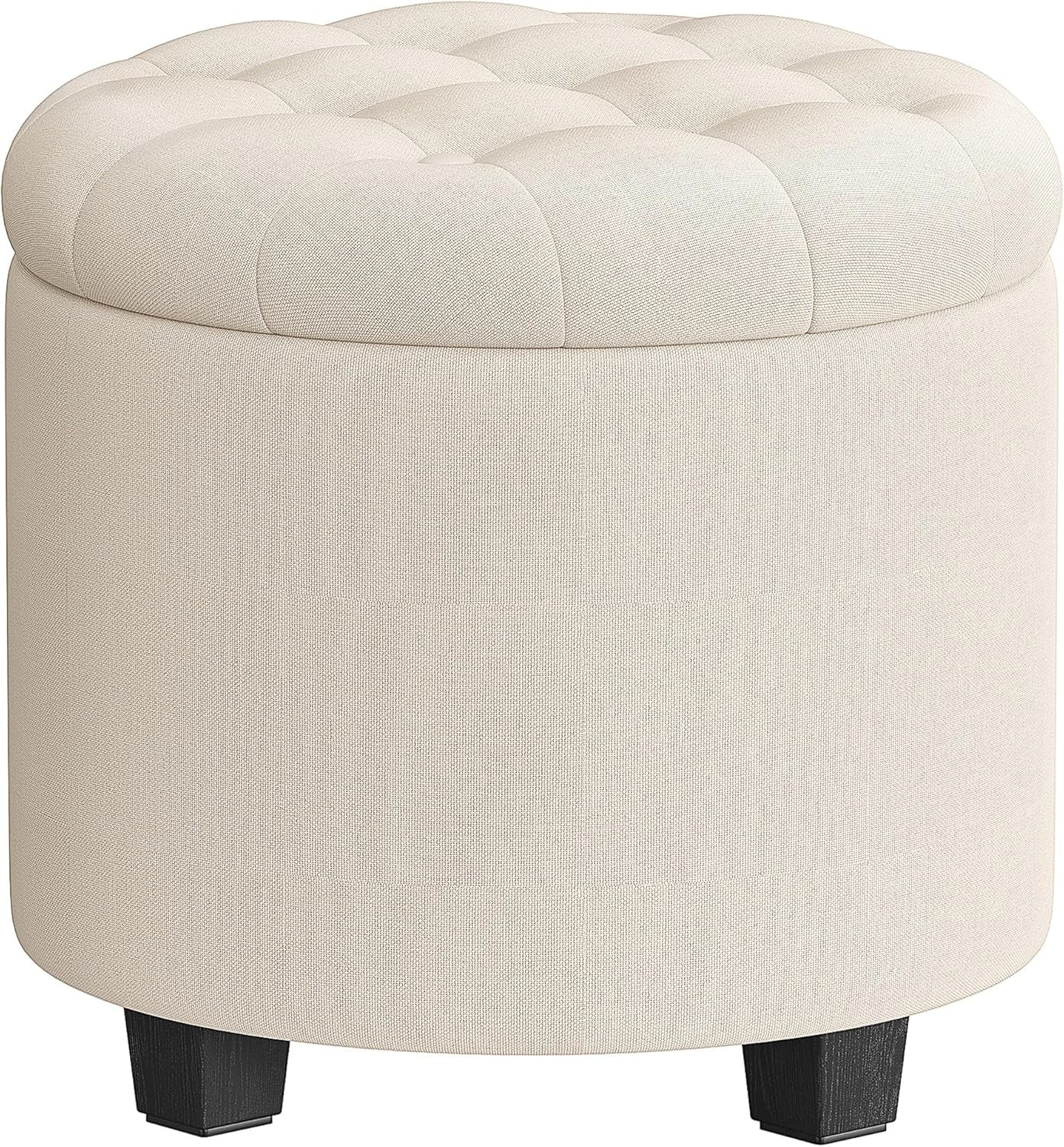 Round light cream fabric ottoman with tufted cushion top and four black block legs, side view
