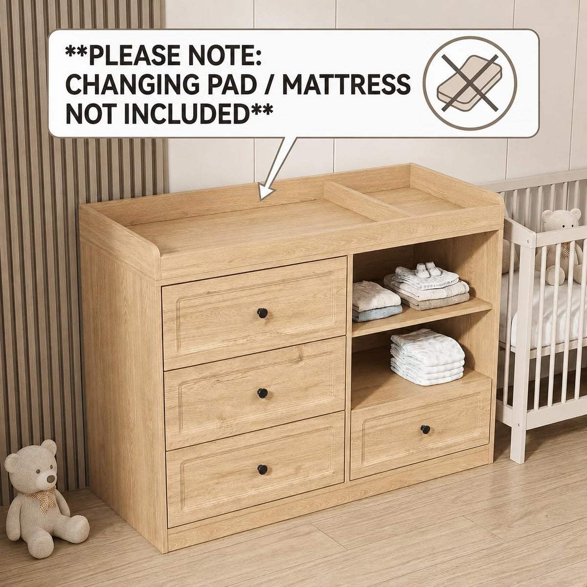Natural wood changing dresser with three drawers left, open shelves right, nursery crib at right