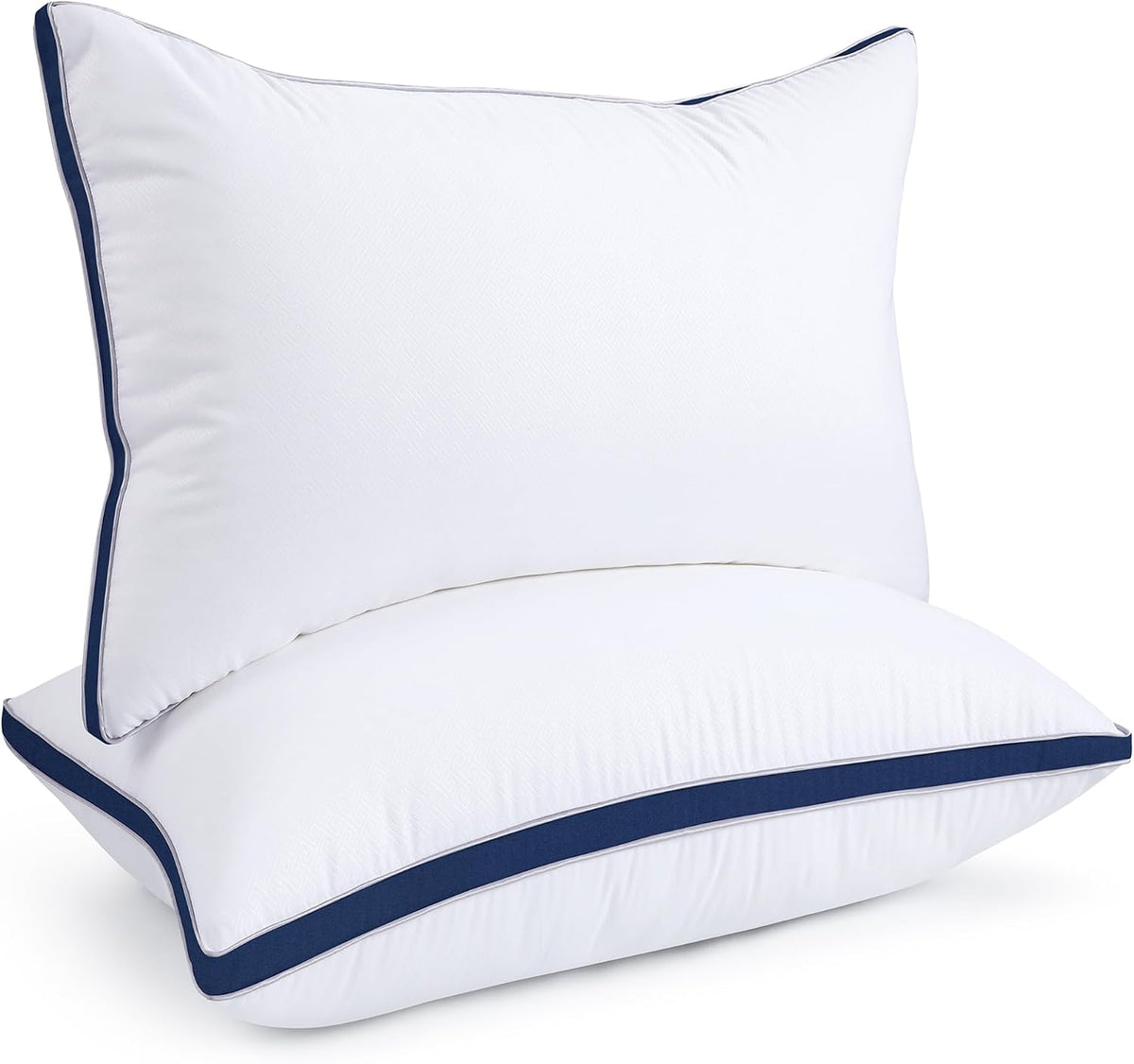 Two stacked white pillows shown close-up with dark navy band and thin gray piping along edges.