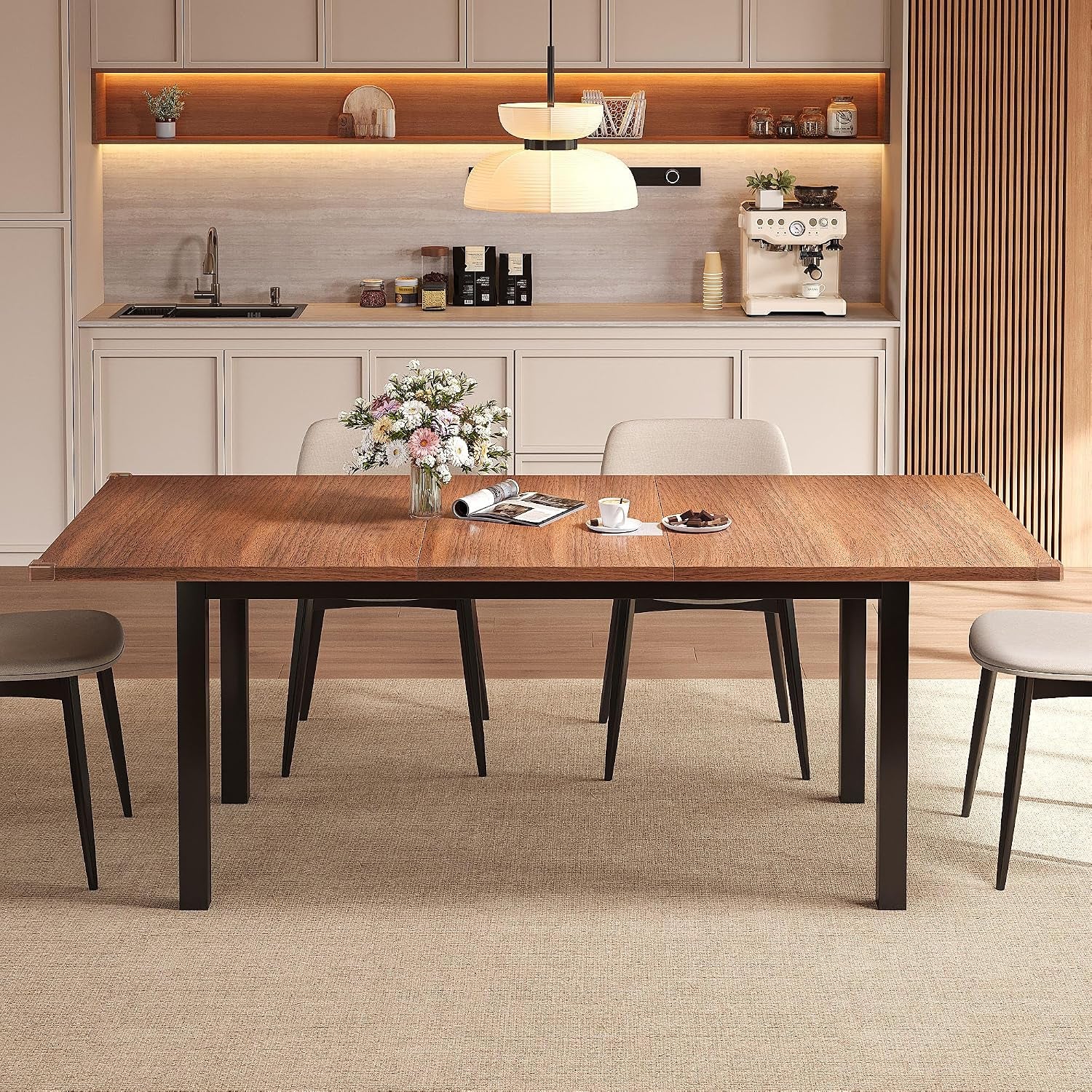 Fully assembled walnut tabletop extended in a kitchen setting with four chairs visible