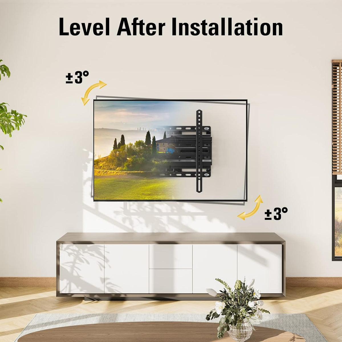 Living room wall with TV on an articulating mount shown tilted slightly left and right above a sideboard.