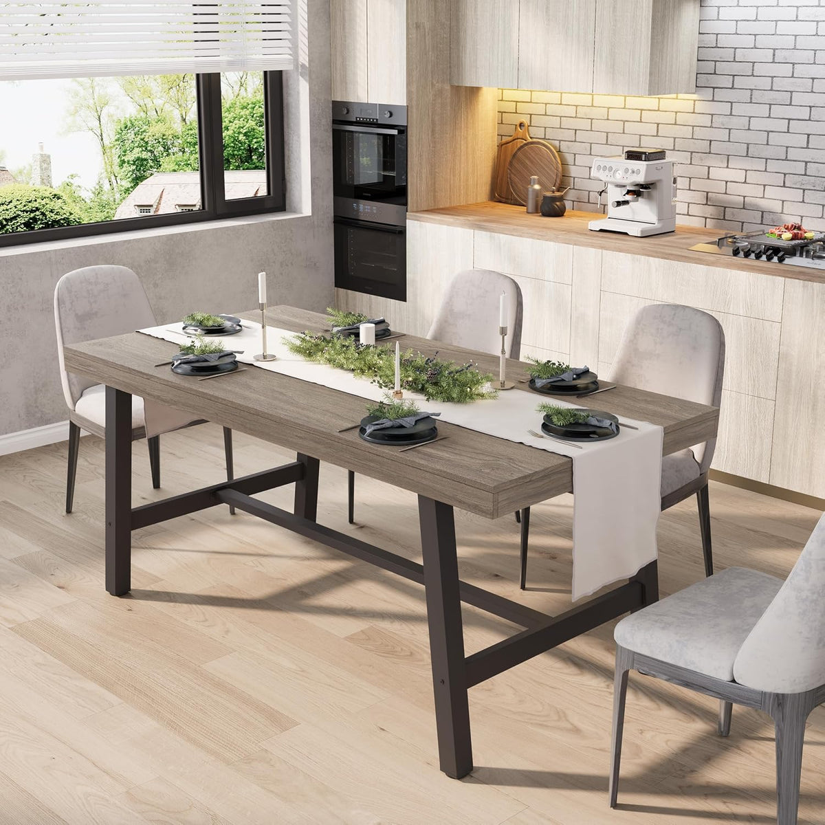 Angled three-quarter view of a rectangular wood-top dining table with dark metal A-frame base in a light kitchen.