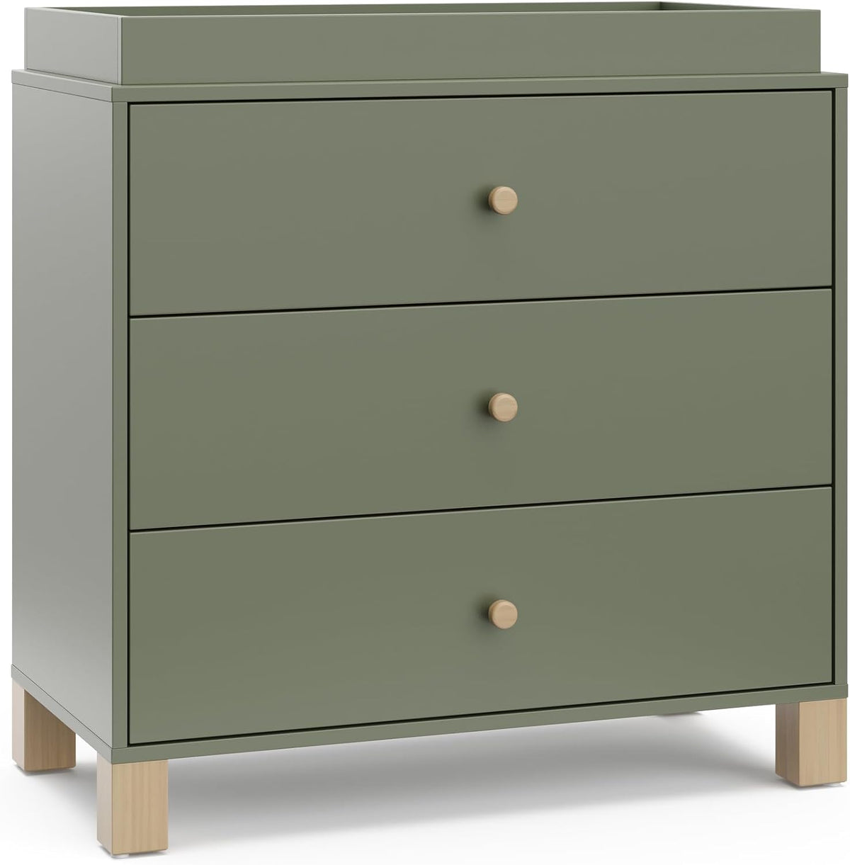Three-drawer sage-green dresser topped with a raised changing tray and light wood block legs.