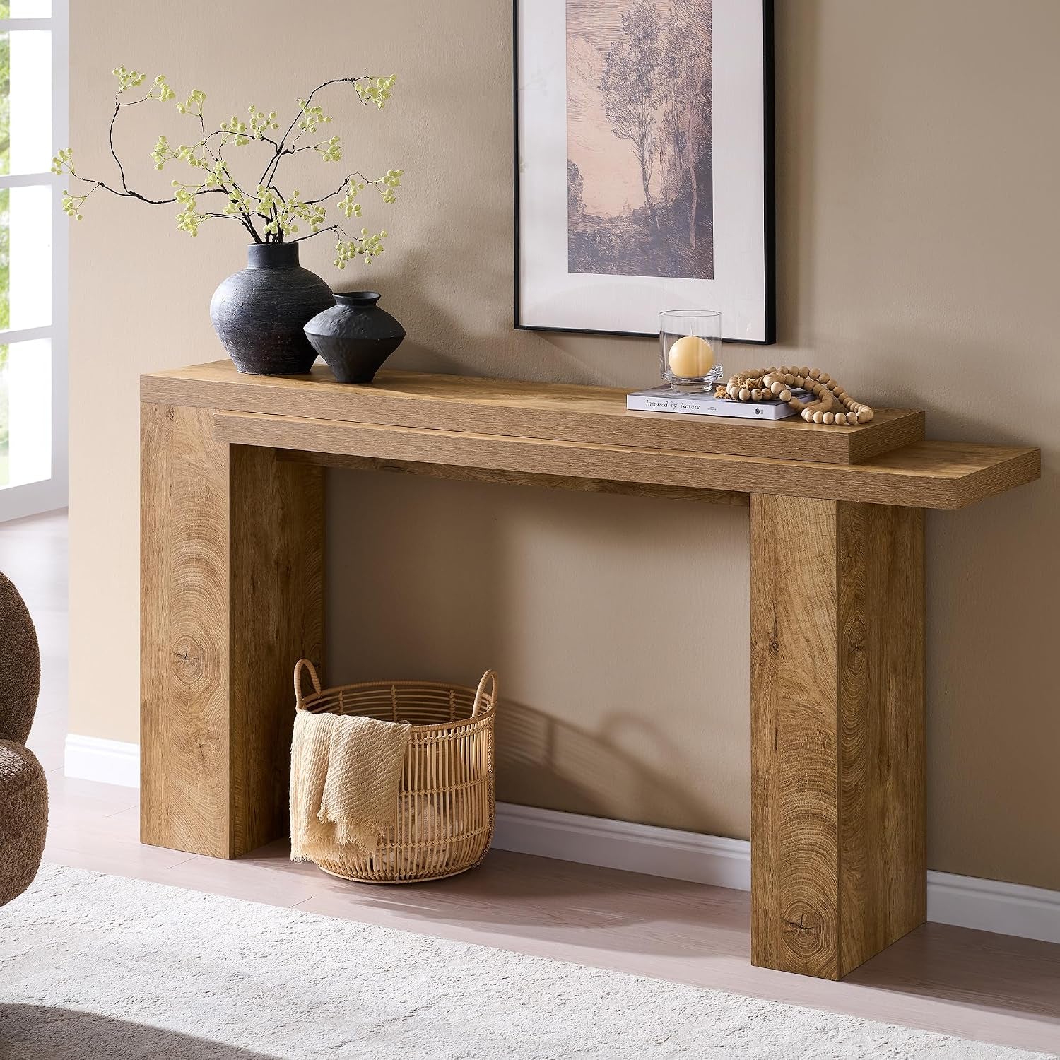 Light tree knot finish console table front-left angled view showing staggered dual tabletop with decorative vases
