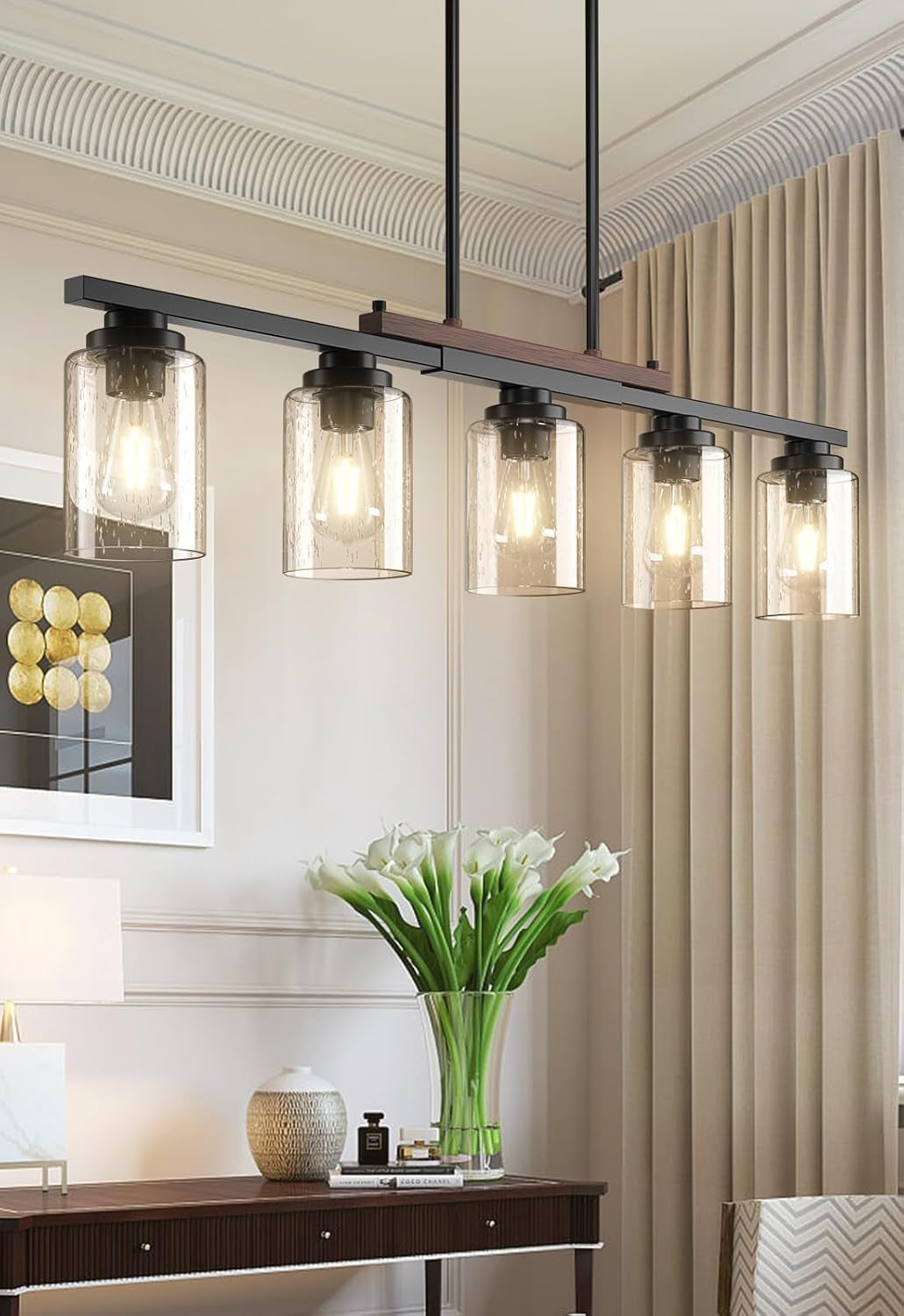 Detail view of the wood-accented metal bar and socket connection on the five-light pendant fixture