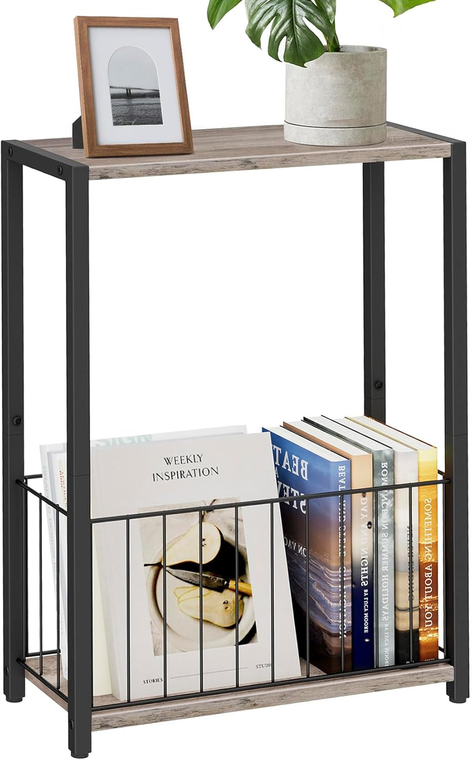 Side table with light weathered wood top, black metal frame and wire magazine basket filled with books