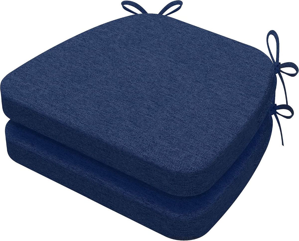 Two navy D-shaped chair pads stacked, view from upper front showing rounded front and tied loops at top corner