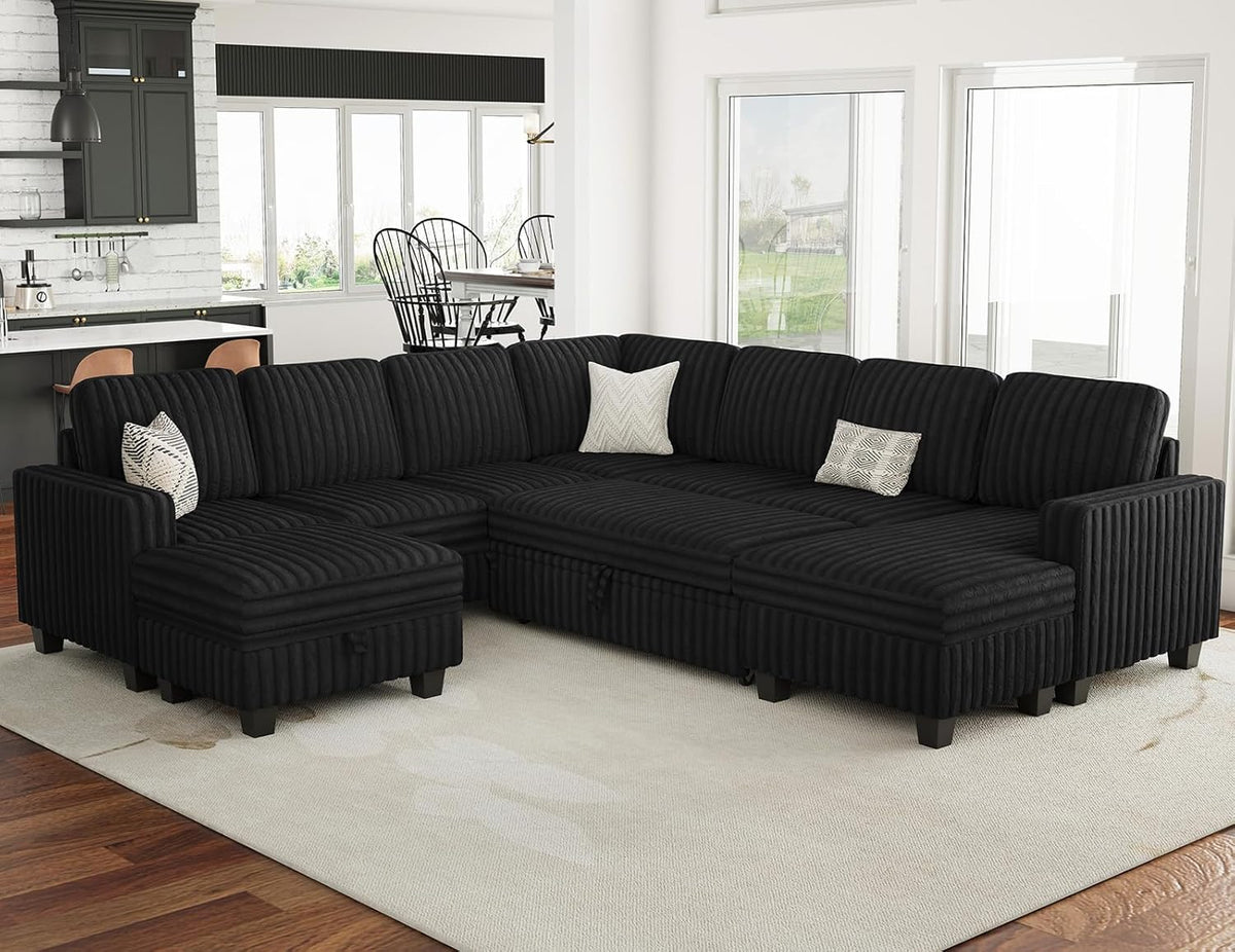 Black plush corduroy modular sectional with right chaise angled front view in a bright living room