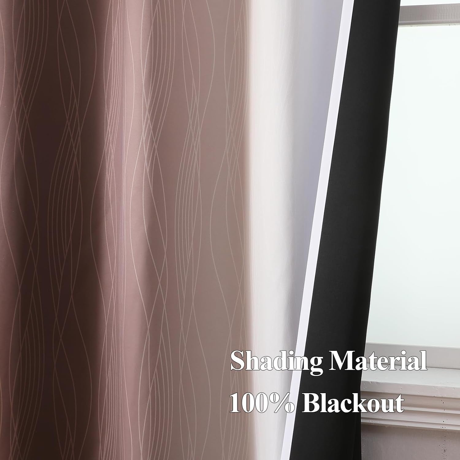 Detail view of curtain edge revealing white inner fabric and the black backing liner exposed at a fold