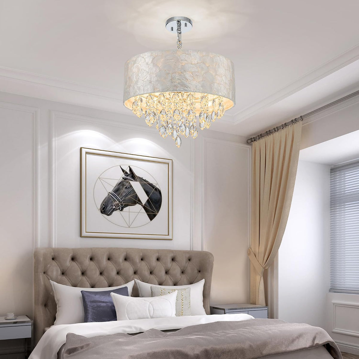 Bedroom scene with a drum-capiz chandelier and hanging crystal teardrops centered over the bed.