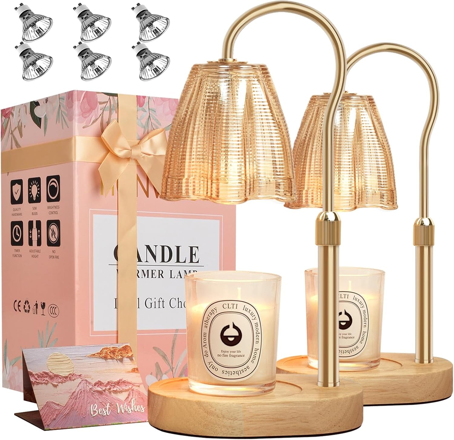 Two amber-shaded candle warmer lamps with oval wooden bases, a floral gift box and spare halogen bulbs
