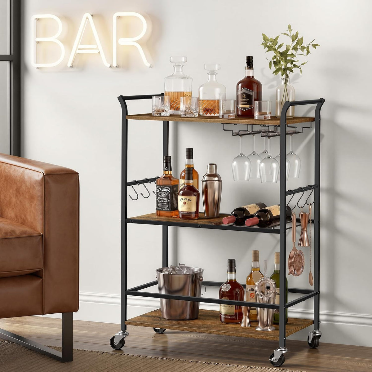 Front-angle view of the cart with rustic brown shelves, glassware hanging underneath and bottles on each shelf.