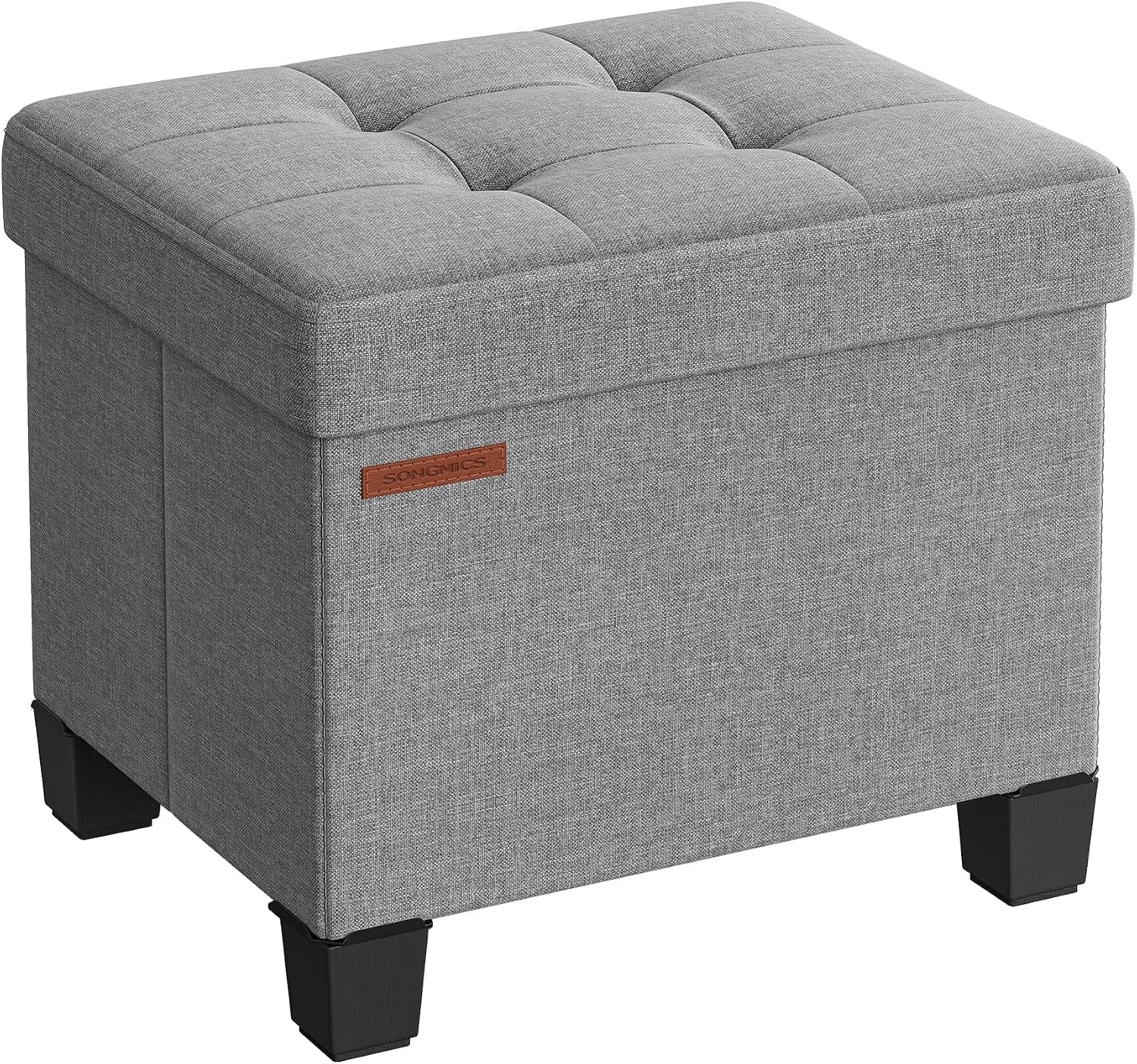 Light gray linen-look square storage ottoman with tufted top and black block legs, angled view.