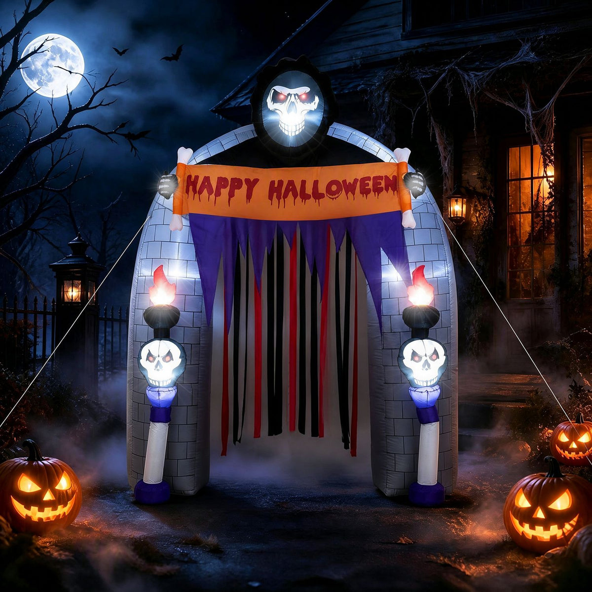 Illuminated Halloween reaper archway with a flowing curtain at night