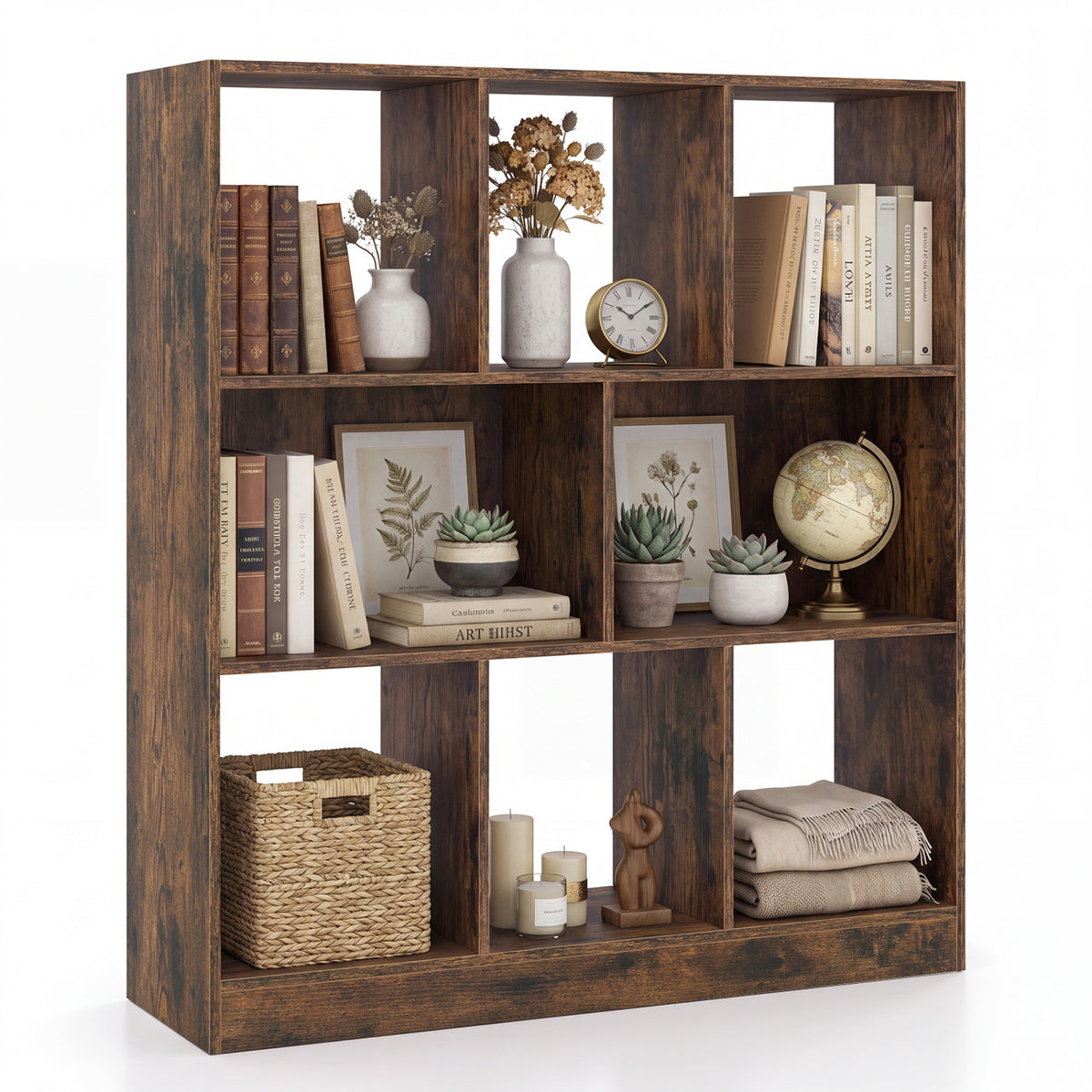 Dark wood cube bookcase filled with books, plants, baskets, folded blankets, and small decor.