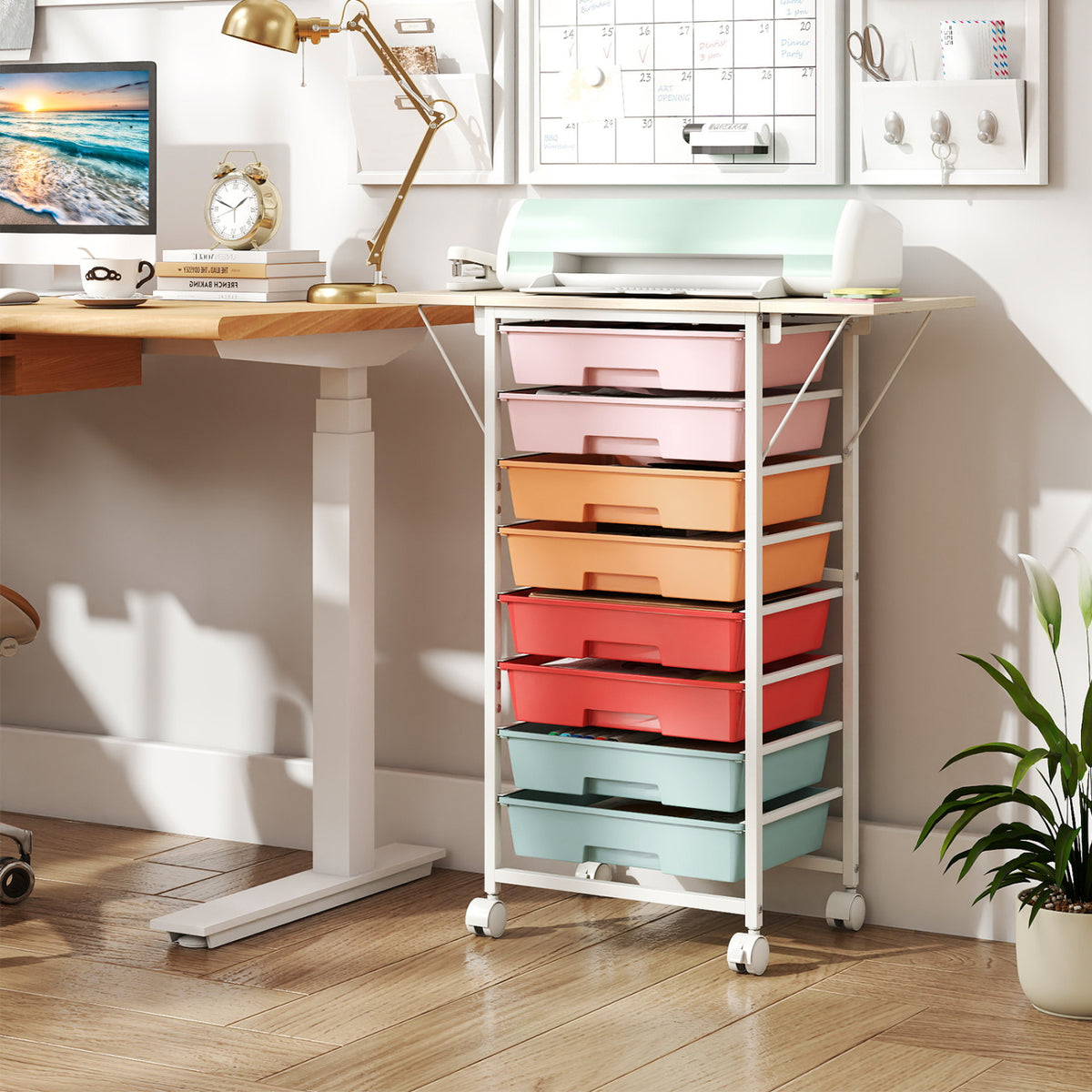 Colorful rolling drawer cart tucked beneath a desk in a bright home office.