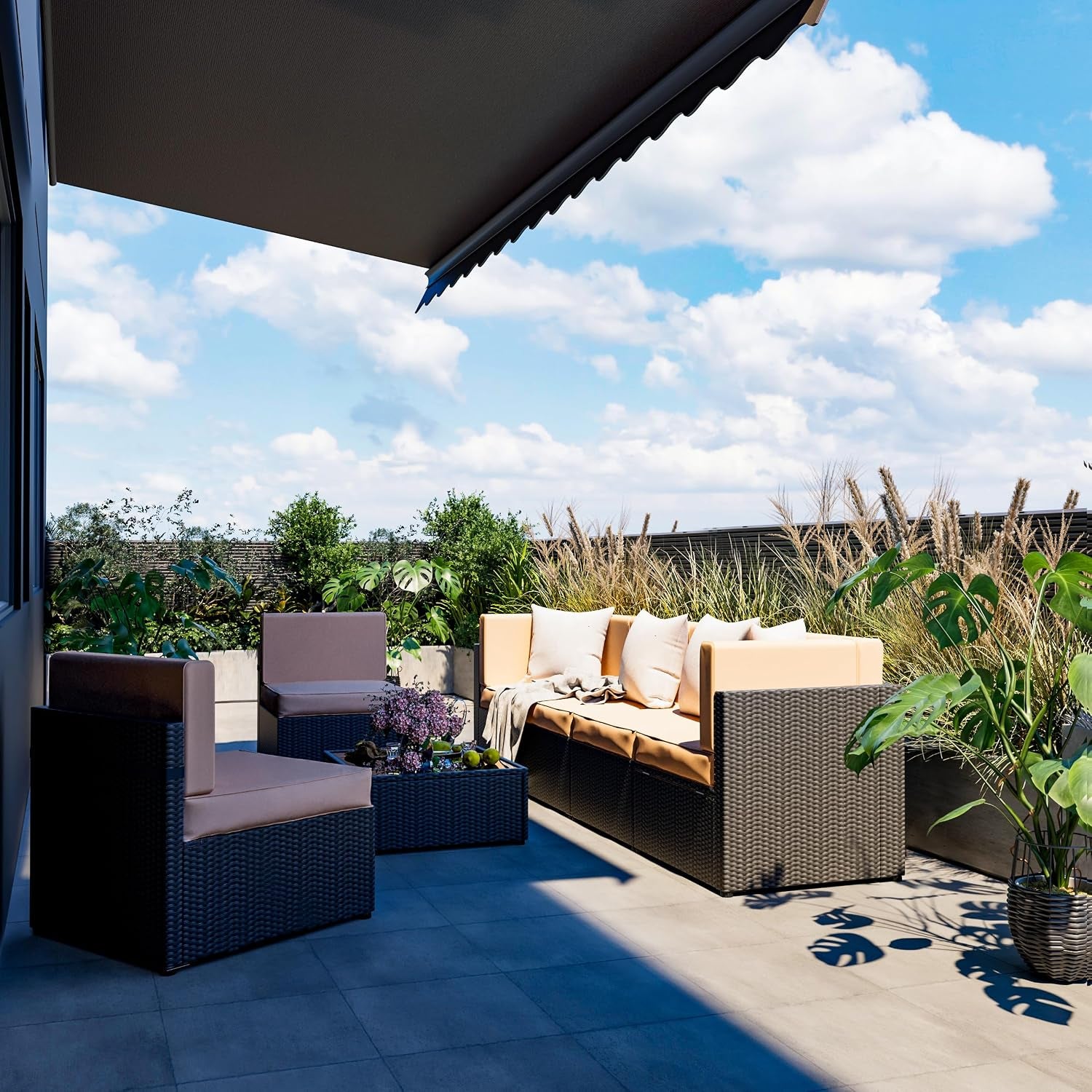 Patio setup showing modular dark rattan sectional and separate chairs with beige cushions under an awning