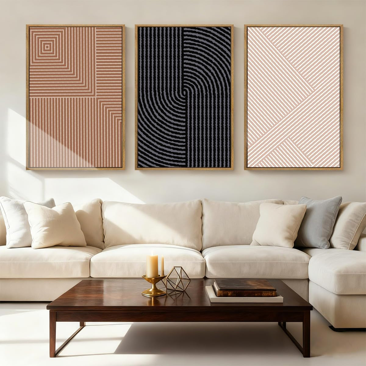 Neutral living room with white sofa and three framed geometric striped art prints in wood frames