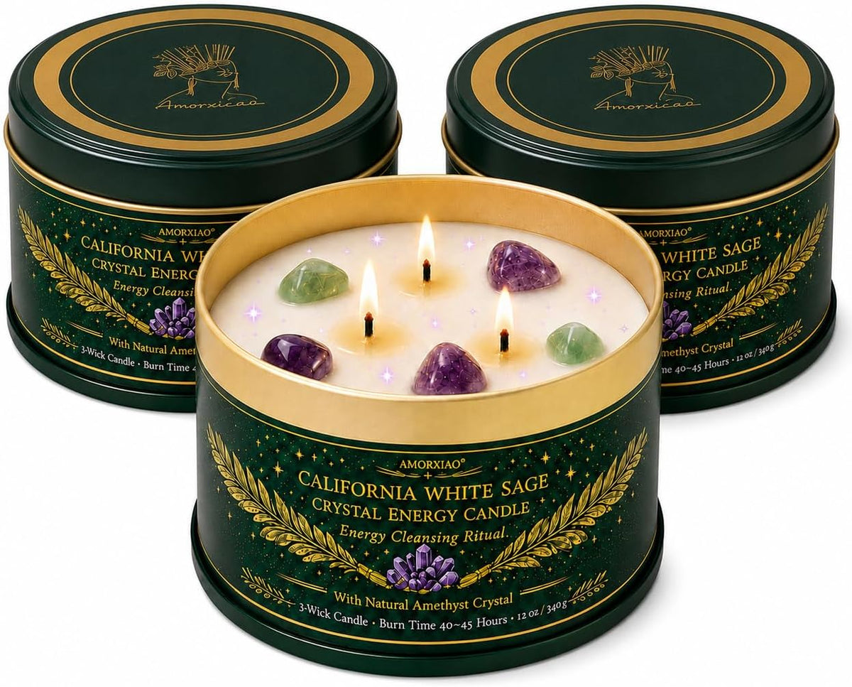 Three green and gold tins grouped together with the front tin open showing three burning wicks and crystals in the wax
