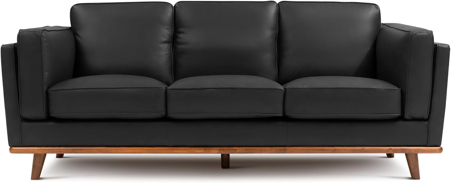Three-seat black leather sofa with straight arms and warm wood base and legs.