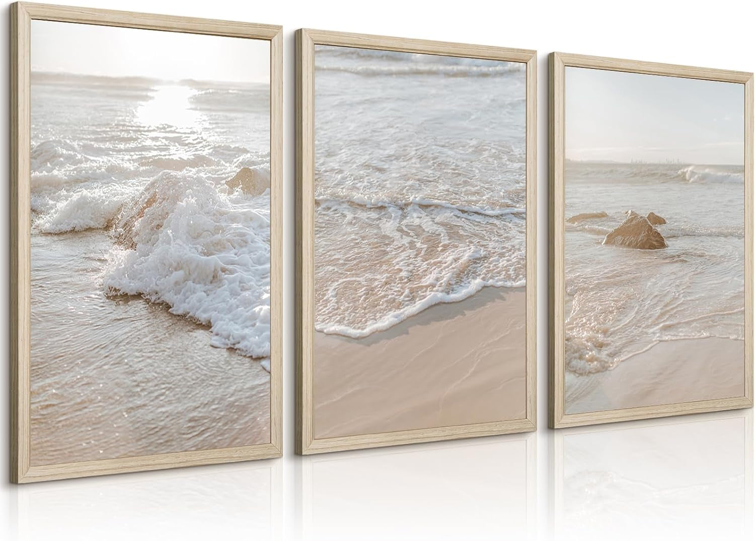 Angled view of the same three wood-framed beach photos showing gentle surf and reflective sand.