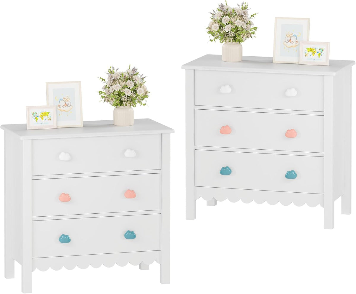 Two white scalloped three-drawer dressers side-by-side on white background with pink and teal cloud knobs.