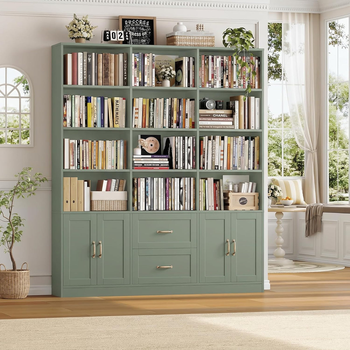 Green bookshelf angled front view in a living room with plants and a window.