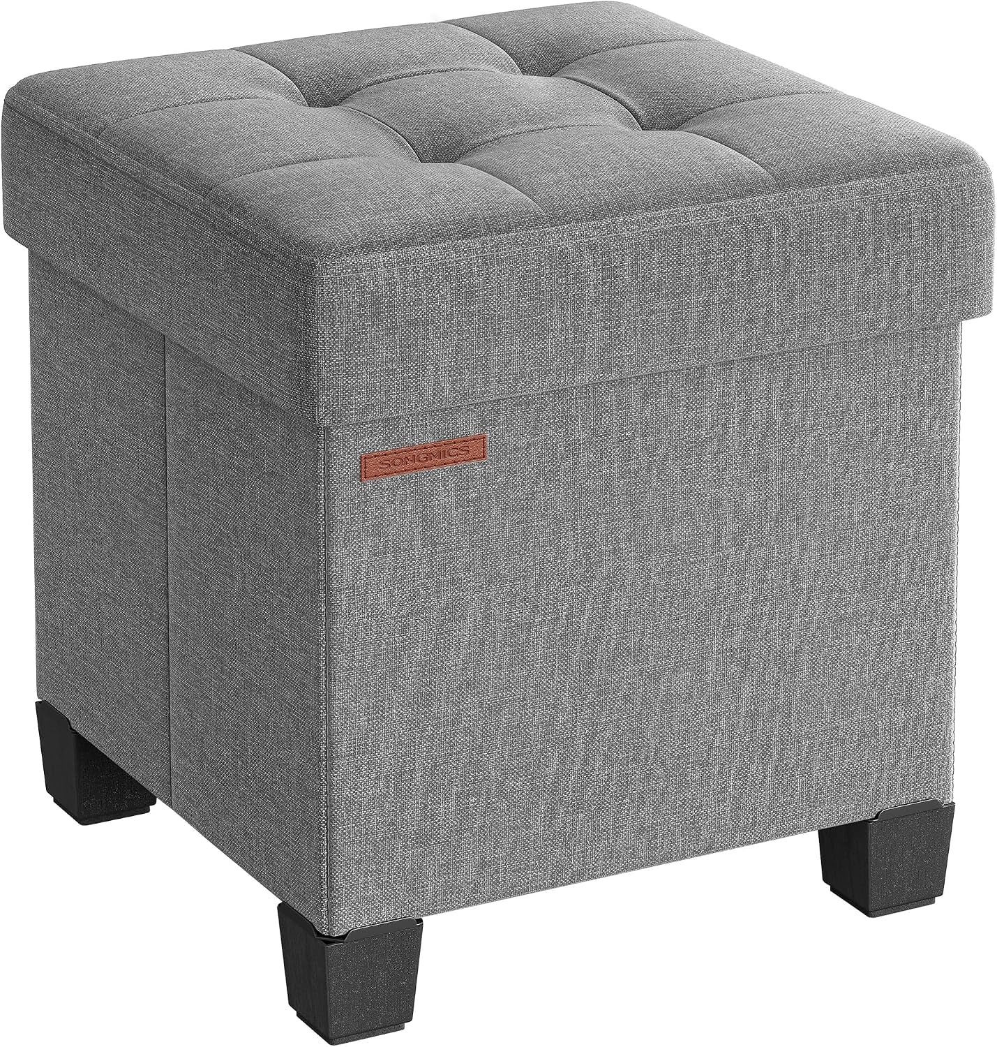 Three-quarter view of a light gray linen-look storage ottoman with button-tufted top and dark block legs