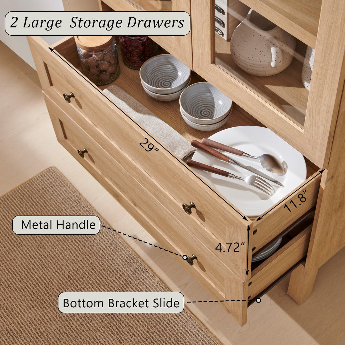 Open lower drawer close-up showing dishes and utensils, metal round pull ring and wood-grain drawer interior