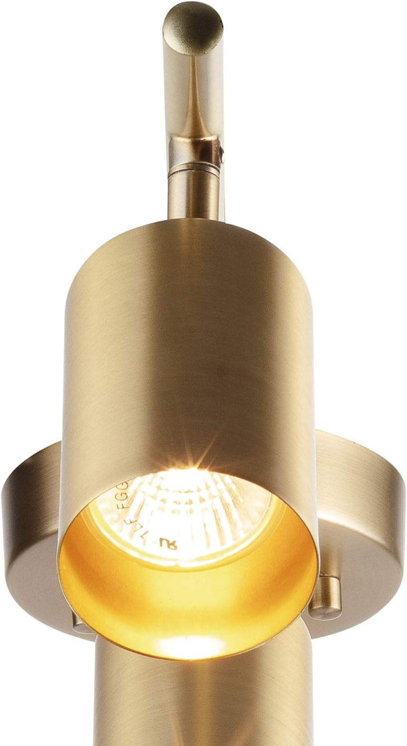 Close-up of a single matte brass cylindrical head with a lit GU10 bulb visible inside the reflector