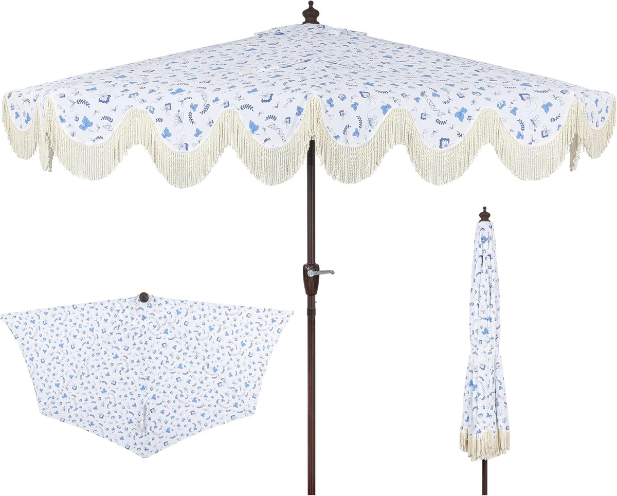 Front view of white umbrella with small blue floral print, scalloped edge and cream fringe; folded and underside insets