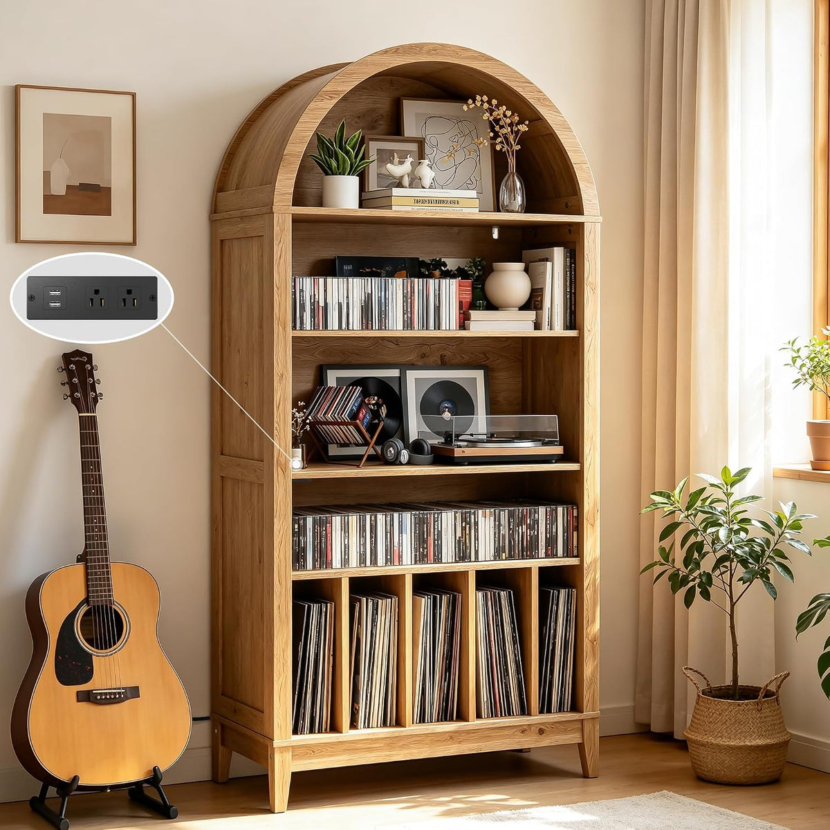 Light wood arched record shelf holding a turntable, vinyl rows and decorative plants beside a guitar