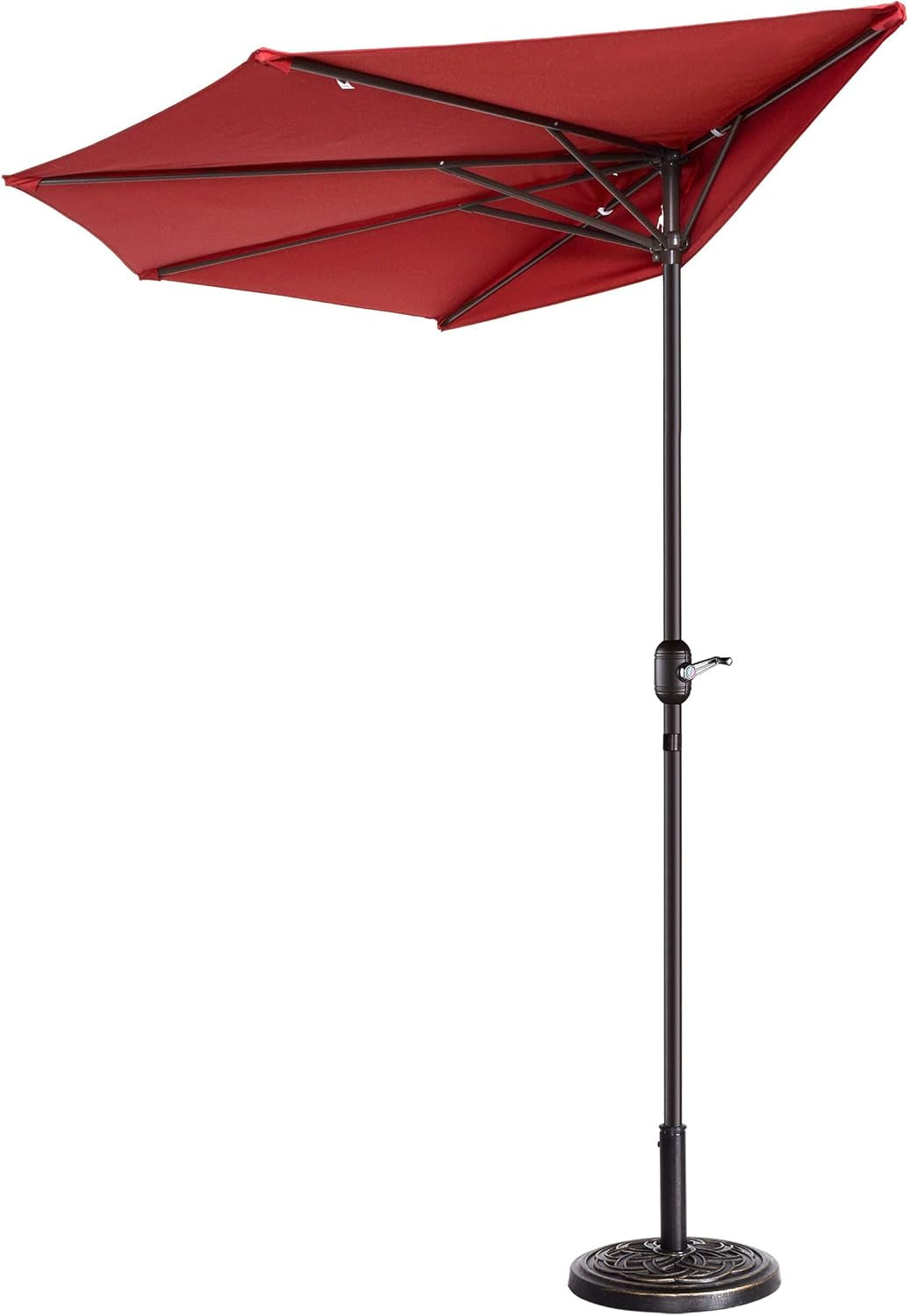 Red half-round umbrella opened to show underside ribs and pole with crank and decorative base