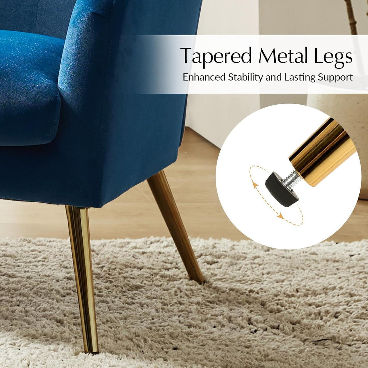 Close-up of a gold-tone tapered metal leg with an adjustable black floor protector under a navy velvet chair on carpet