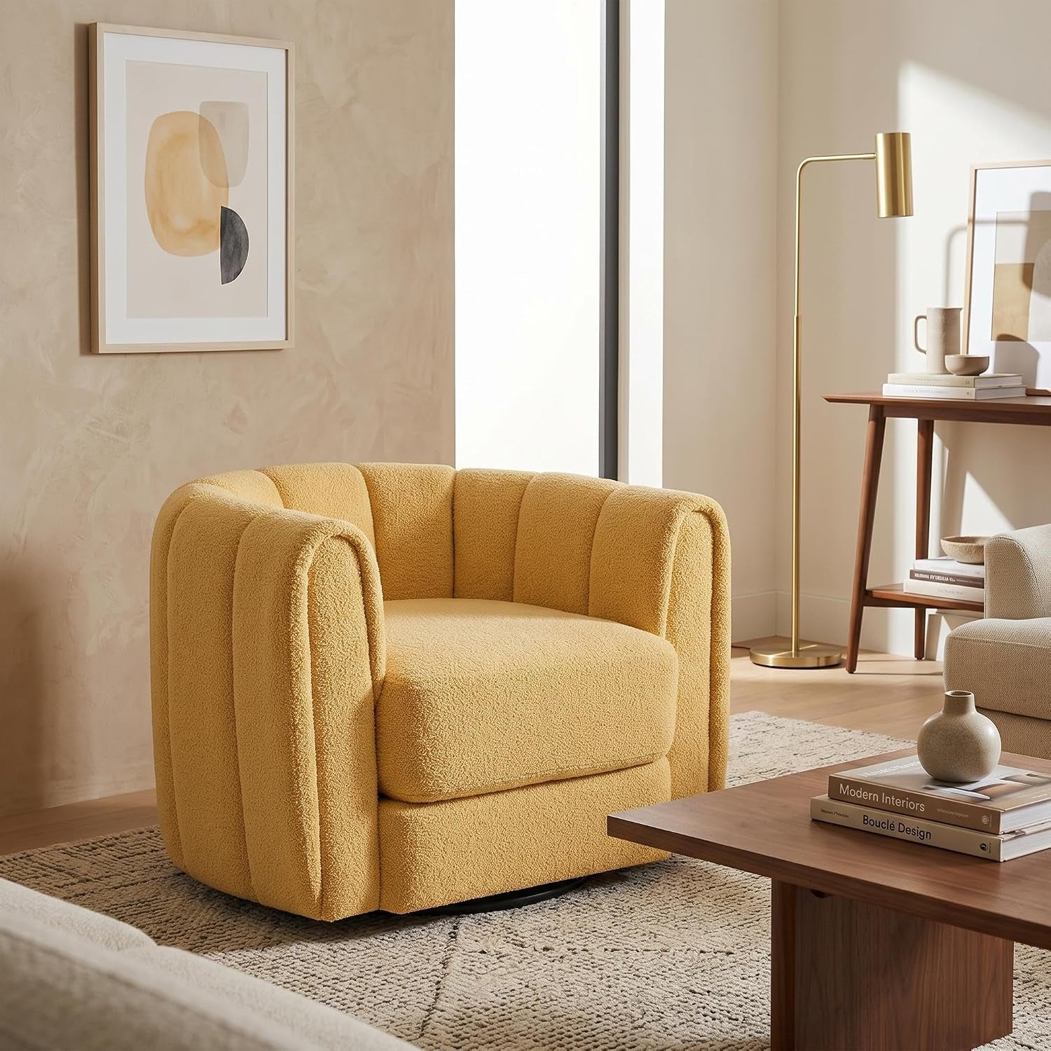 Single mustard-yellow barrel swivel chair placed on a patterned rug near a floor lamp and side table.