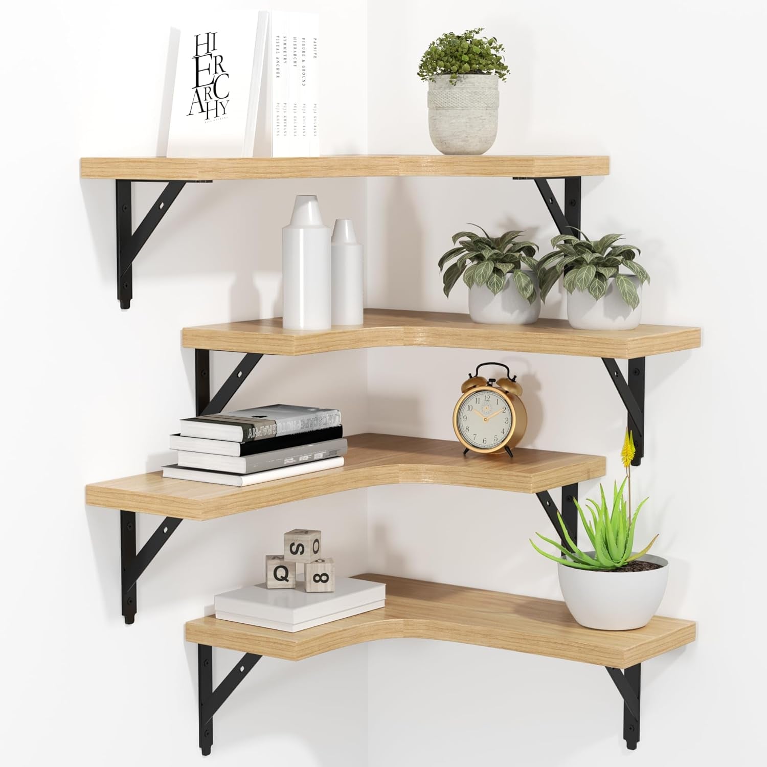 Corner display of four natural wood L-shaped floating shelves with black metal brackets and decor