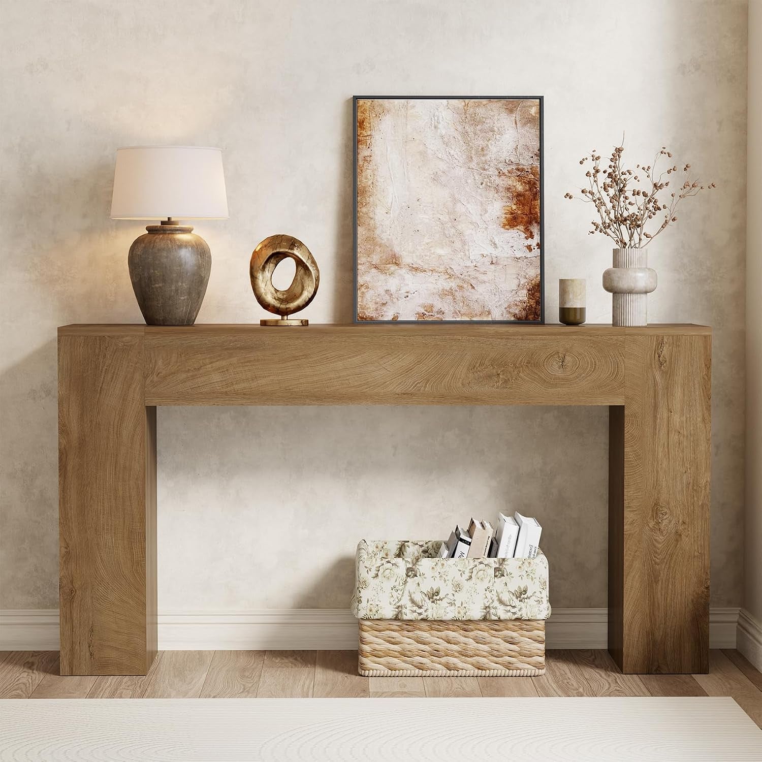 Close frontal view of a warm medium-oak console table showing visible wood ring patterns on the tabletop.